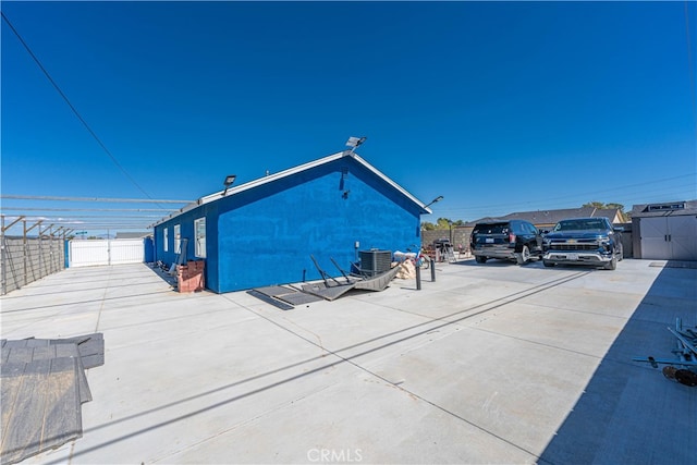 exterior space with a patio and central AC