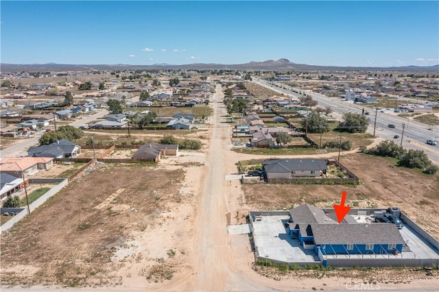 birds eye view of property with a mountain view