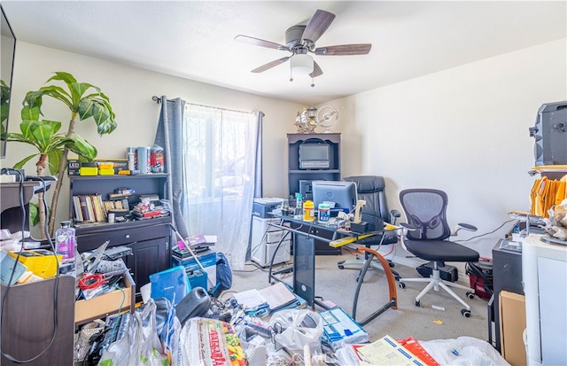 office area featuring light carpet and ceiling fan