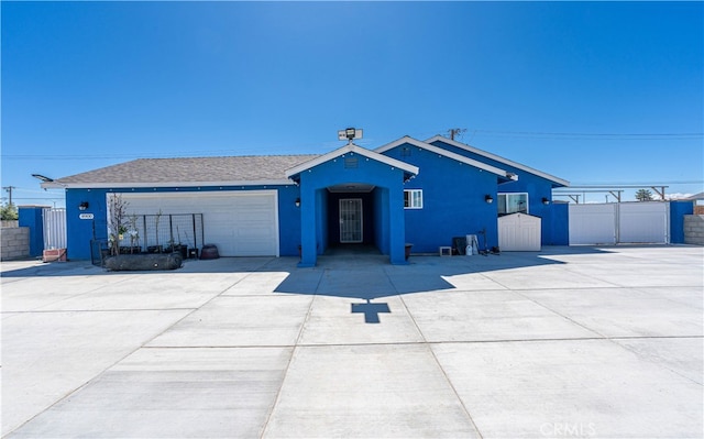 ranch-style house featuring a garage