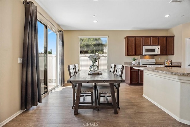 dining area featuring dark hardwood / wood-style floors