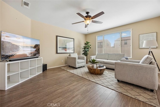 living room with hardwood / wood-style flooring and ceiling fan