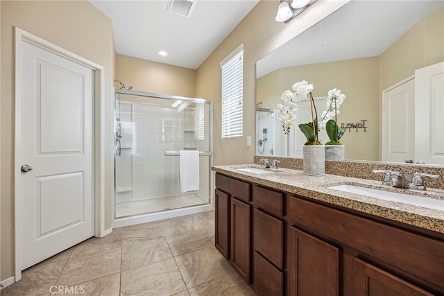 bathroom with vanity and an enclosed shower