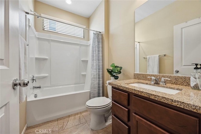 full bathroom with vanity, shower / bath combo, and toilet