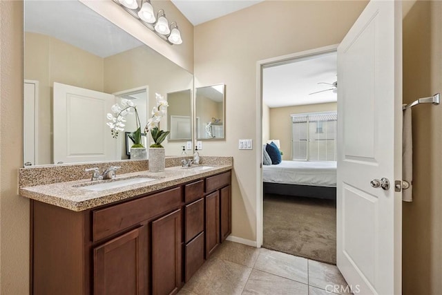 bathroom featuring ceiling fan, tile patterned flooring, and vanity