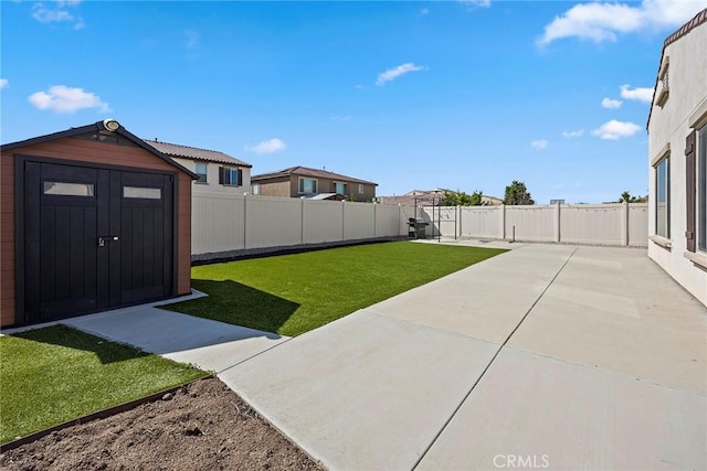 view of yard with a storage unit and a patio