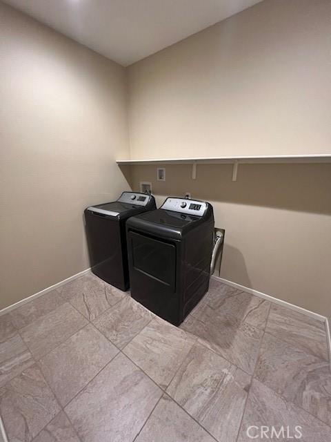 laundry area with washing machine and dryer