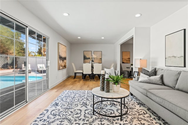 living room with light hardwood / wood-style flooring