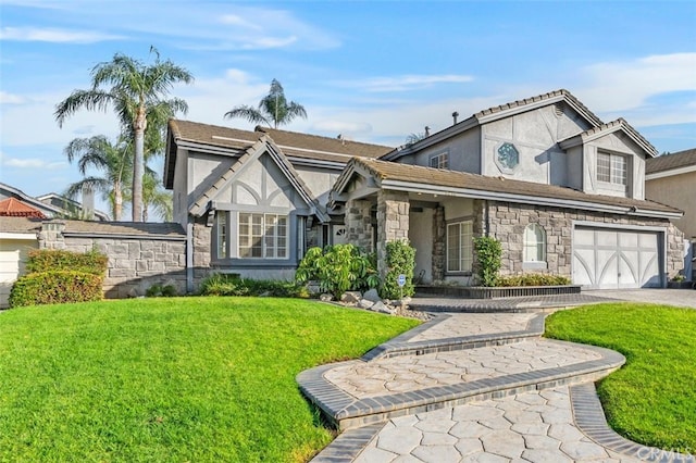 tudor house with a front lawn and a garage