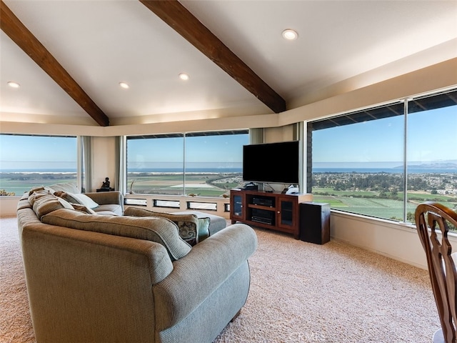 carpeted living room featuring beamed ceiling and a water view