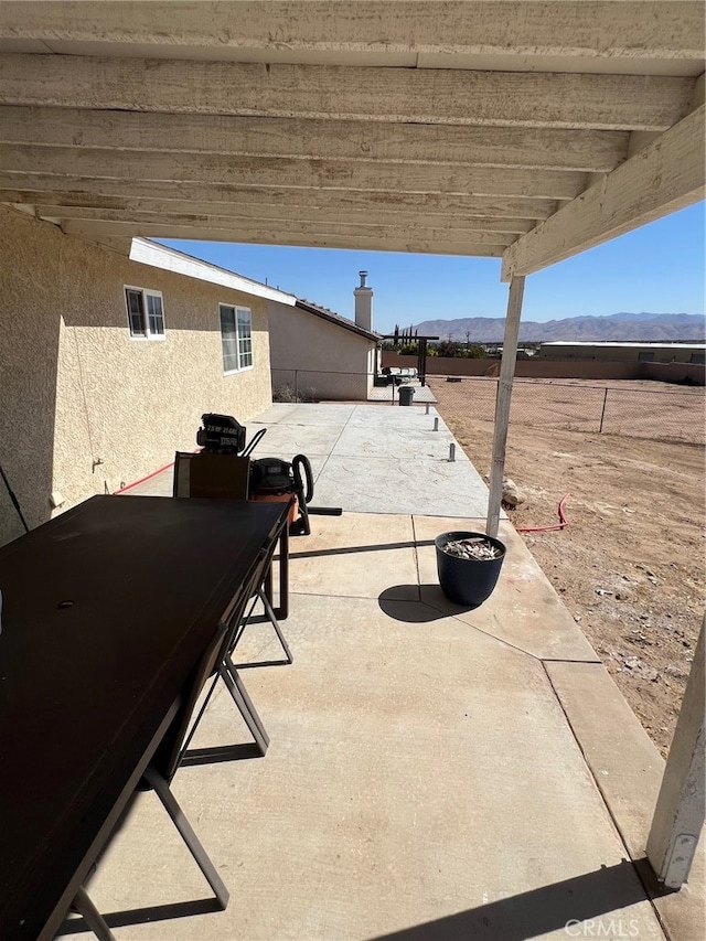 view of patio with a mountain view