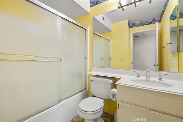 full bathroom with toilet, combined bath / shower with glass door, and vanity