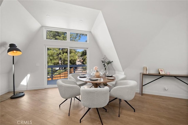 dining space with light hardwood / wood-style floors