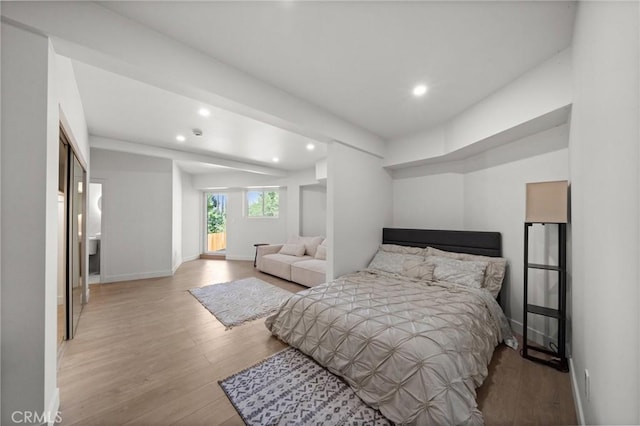 bedroom with light wood-type flooring