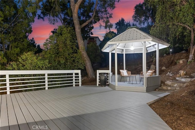 deck at dusk with a gazebo