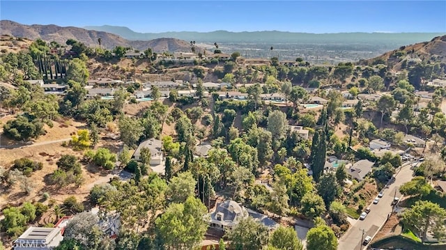 birds eye view of property with a mountain view