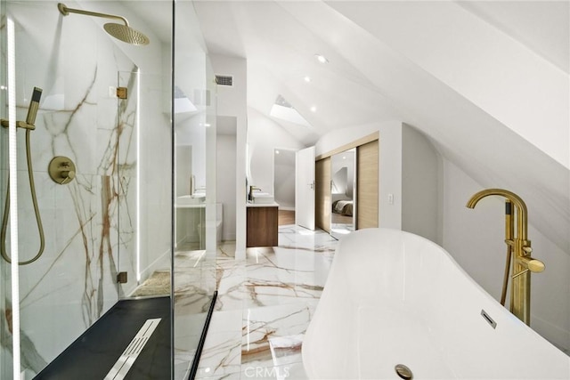 bathroom featuring vaulted ceiling, independent shower and bath, and vanity