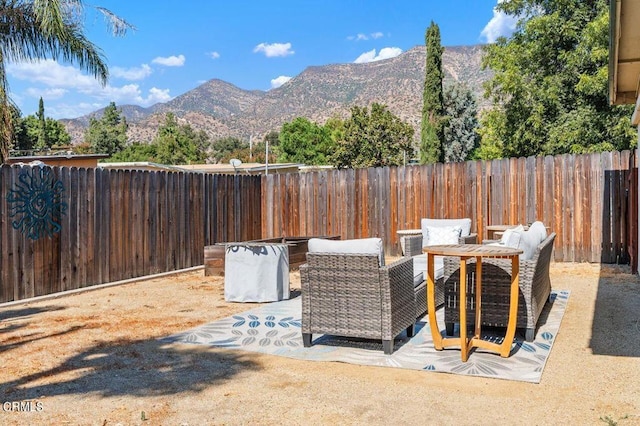 view of patio / terrace featuring a mountain view