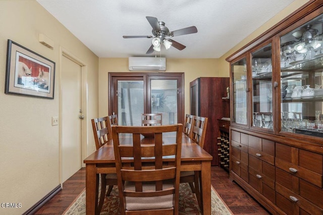 dining room with ceiling fan, a wall mounted AC, and dark hardwood / wood-style floors