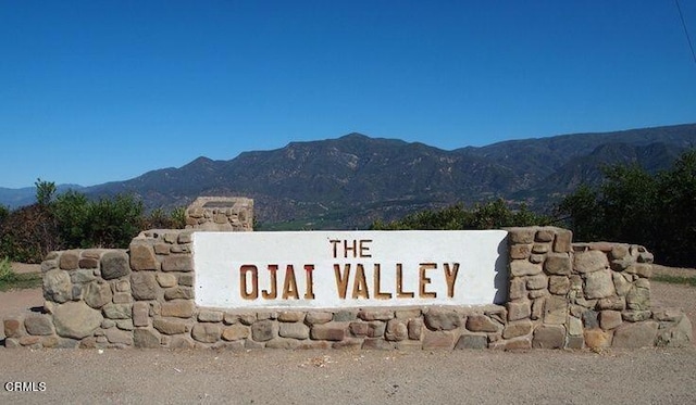 community sign featuring a mountain view