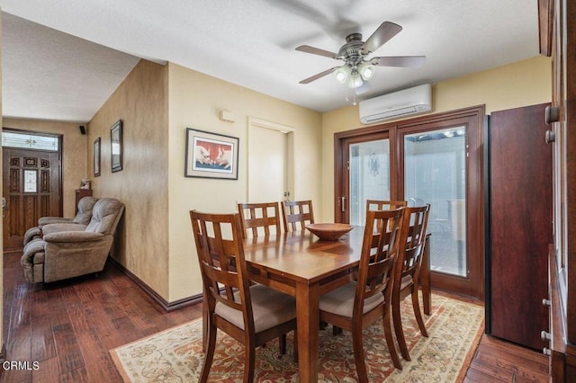 dining room with ceiling fan, an AC wall unit, a textured ceiling, and dark hardwood / wood-style floors