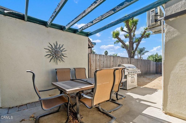 view of patio / terrace with area for grilling and a pergola