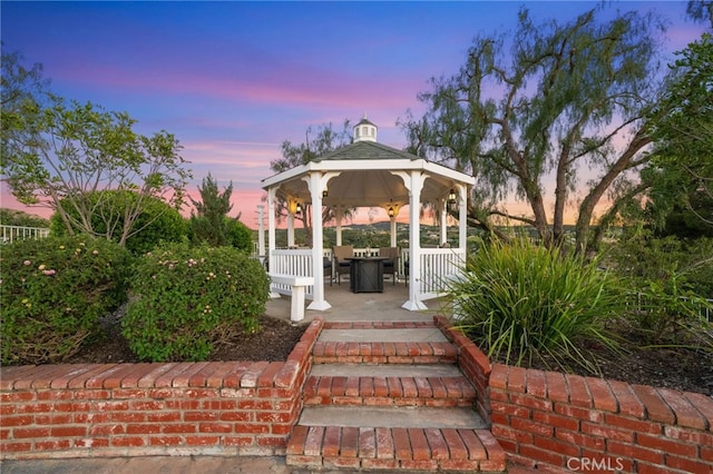 patio terrace at dusk with a gazebo