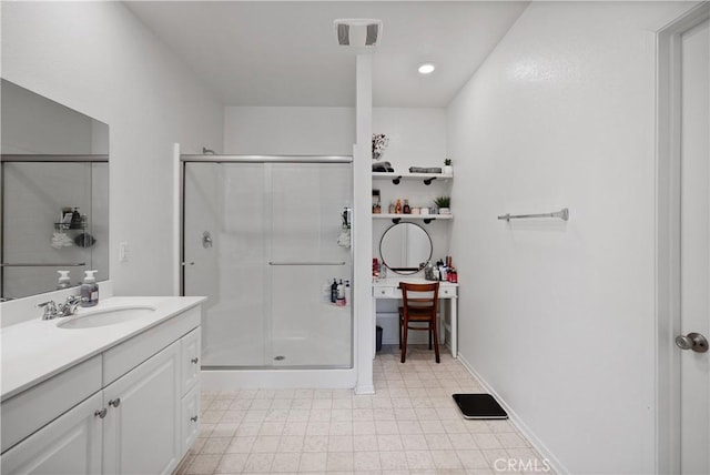 bathroom with vanity and an enclosed shower