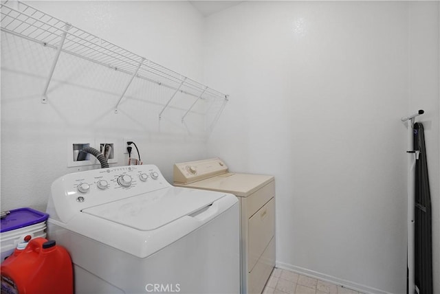 washroom with independent washer and dryer