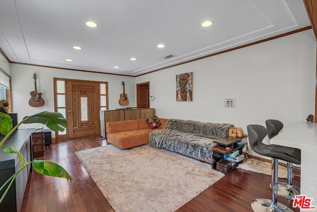 living room with dark hardwood / wood-style floors and crown molding