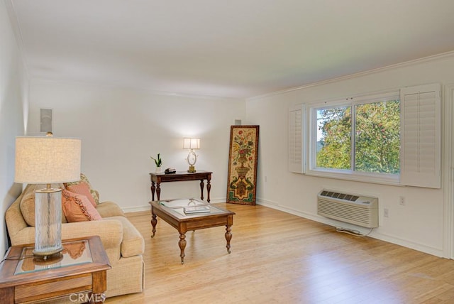 living room with an AC wall unit, light hardwood / wood-style flooring, and crown molding