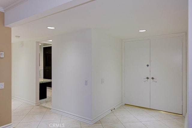 hallway featuring light tile patterned floors