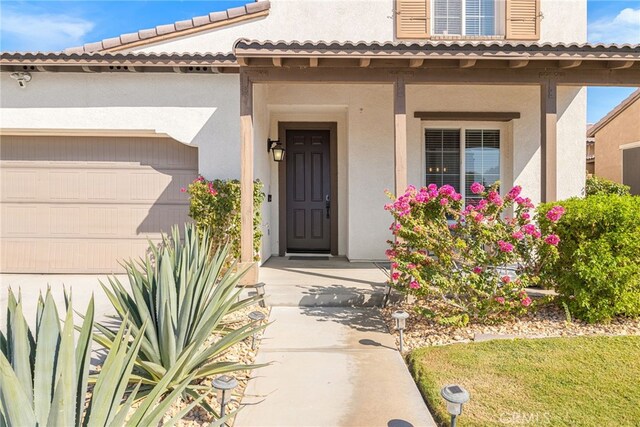 property entrance with a garage