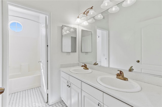 bathroom featuring shower / bath combo with shower curtain, tile patterned floors, and vanity