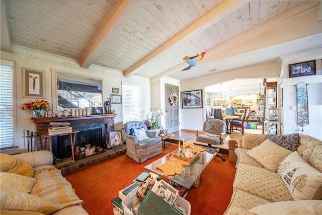 living room featuring wood ceiling, carpet, lofted ceiling with beams, and a brick fireplace