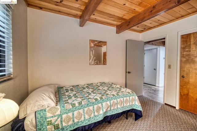 bedroom with wood ceiling, beamed ceiling, and carpet flooring