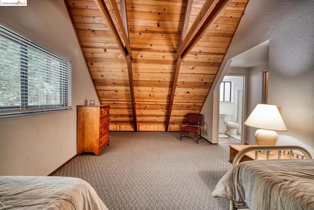 carpeted bedroom with lofted ceiling with beams, ensuite bath, and wooden ceiling