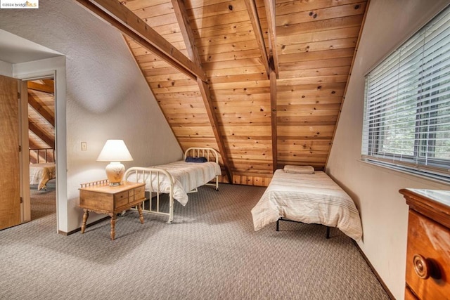 bedroom featuring carpet floors, vaulted ceiling with beams, and wooden ceiling