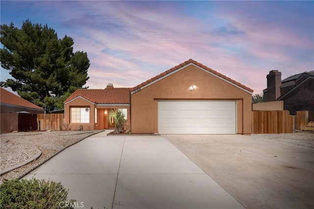 view of front of property with a garage