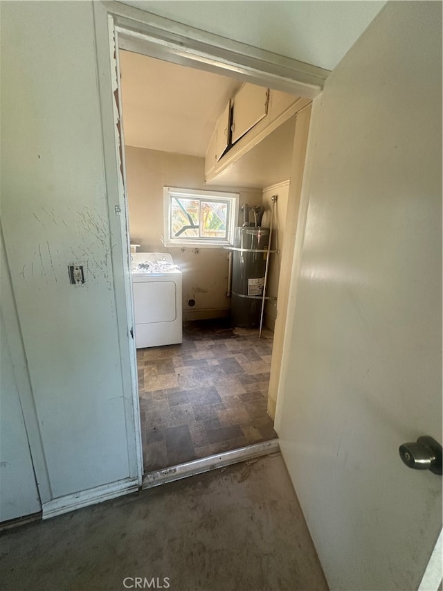 clothes washing area featuring washer / clothes dryer and secured water heater