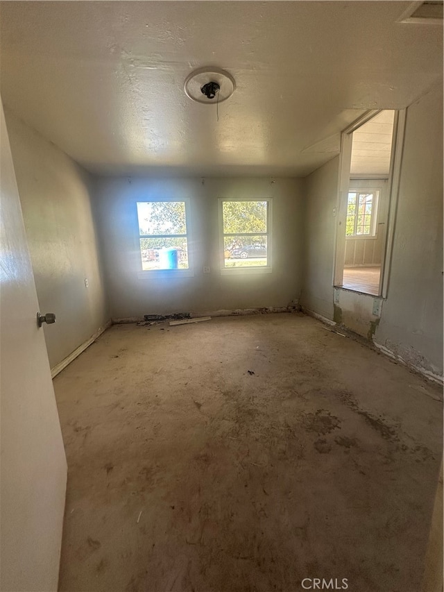 empty room with a textured ceiling