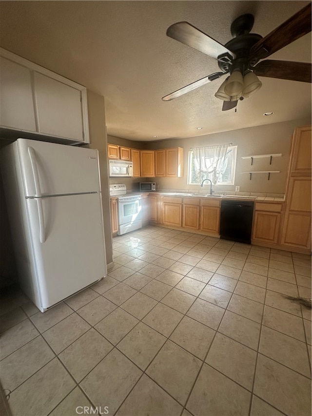 kitchen featuring light brown cabinetry, light tile patterned floors, white appliances, and ceiling fan