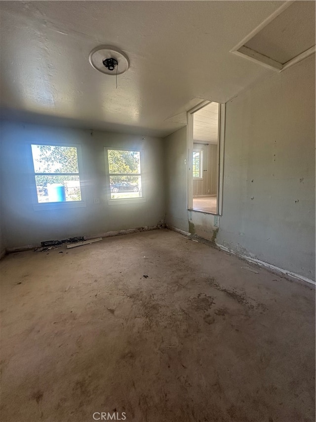 empty room with a textured ceiling