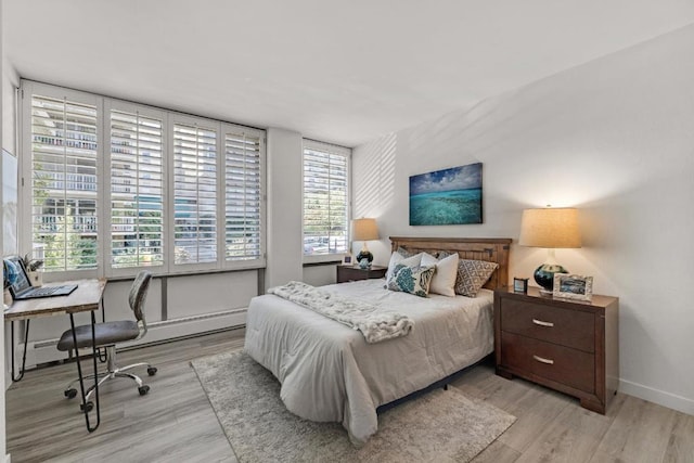 bedroom with light wood-type flooring