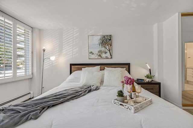 bedroom featuring a baseboard radiator