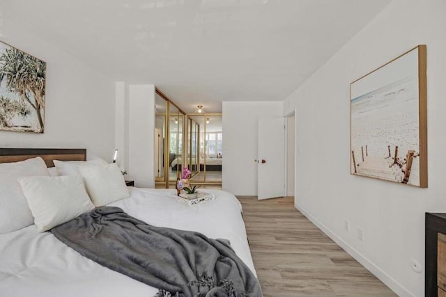 bedroom featuring a closet and light wood-type flooring