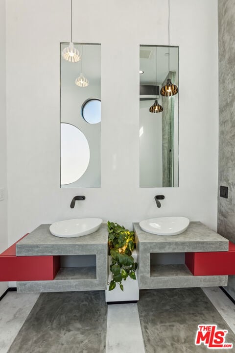 bathroom with vanity and concrete floors