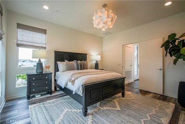 bedroom with dark wood-type flooring