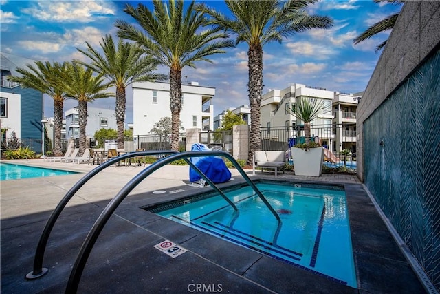 view of pool with a community hot tub