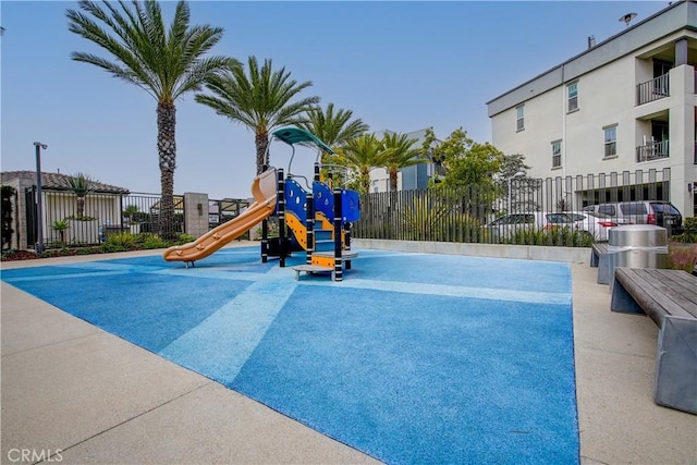 view of pool featuring a playground